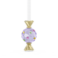A hanging ornament shaped like a wrapped candy, featuring a faceted lavender-purple crystal ball with small multicolored star accents and gold-tone top and bottom details, suspended from a white ribbon on a plain white background.