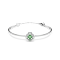 A silver bangle bracelet featuring a central floral cluster with a vibrant green heart-shaped gemstone surrounded by small clear stones, set against a plain white background.