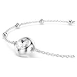 Silver bracelet with a heart-shaped clasp and clear gemstone on a white background