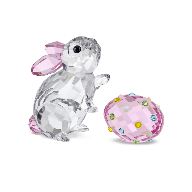Crystal rabbit figurine with pink bow and crystal-embellished pink egg on a white background