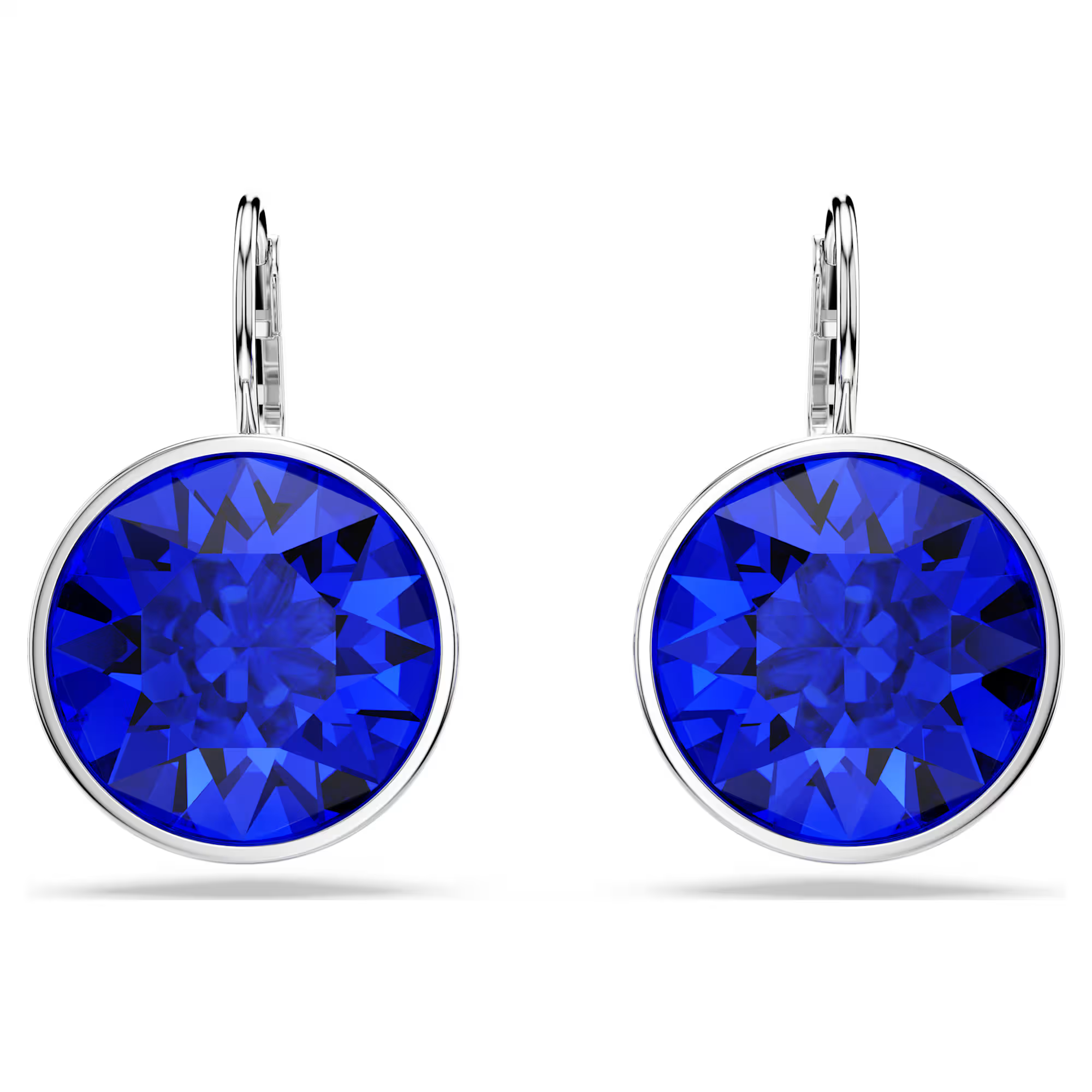 A pair of round-cut deep blue Swarovski crystal earrings with rhodium plating, attached to small silver hooks.