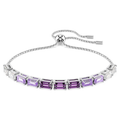 A rhodium plated tennis bracelet with a sliding closure, decorated with octagon step-cut Swarovski Zirconia in a gradient of color from clear to purple.