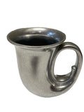 Metallic cup with a handle on a white background
